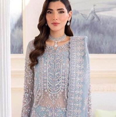 "Ya Kawal Malik article featuring a full handmade organza shirt with embroidered back and sleeves, paired with a ready-to-wear organza dupatta. Available in two elegant color options."